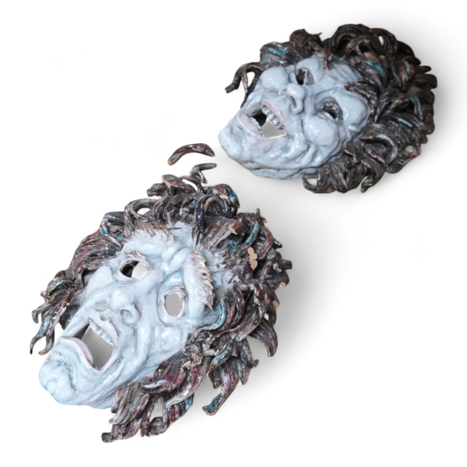 Eugenio Pattarino (1885–1971), two Italian maiolica comedy & tragedy wall masks, 30cm high